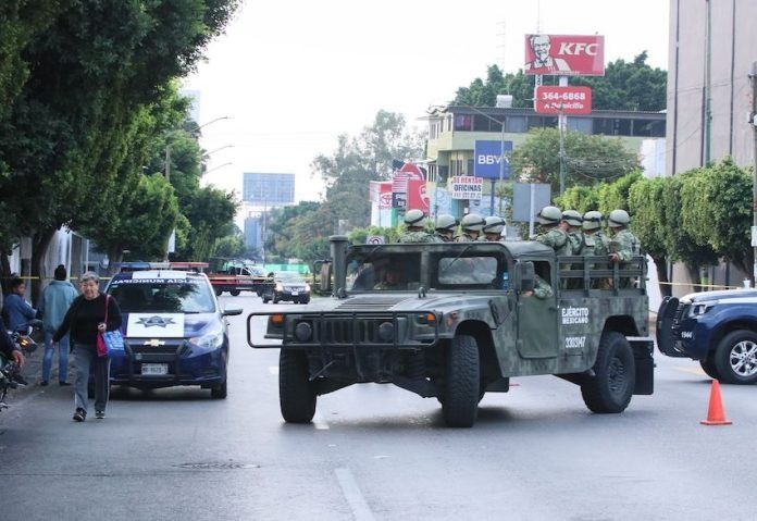 957011_Cuernavaca-Enfrentamientos-Policia-1_impreso-696x479.jpg